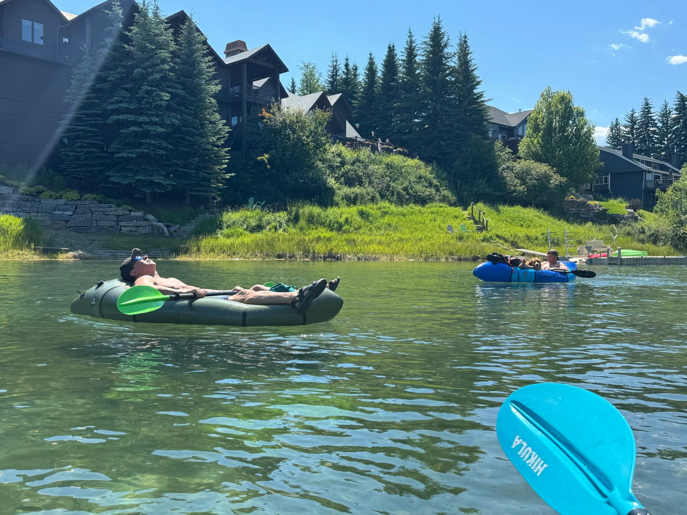 Packrafts floating on a mountain lake