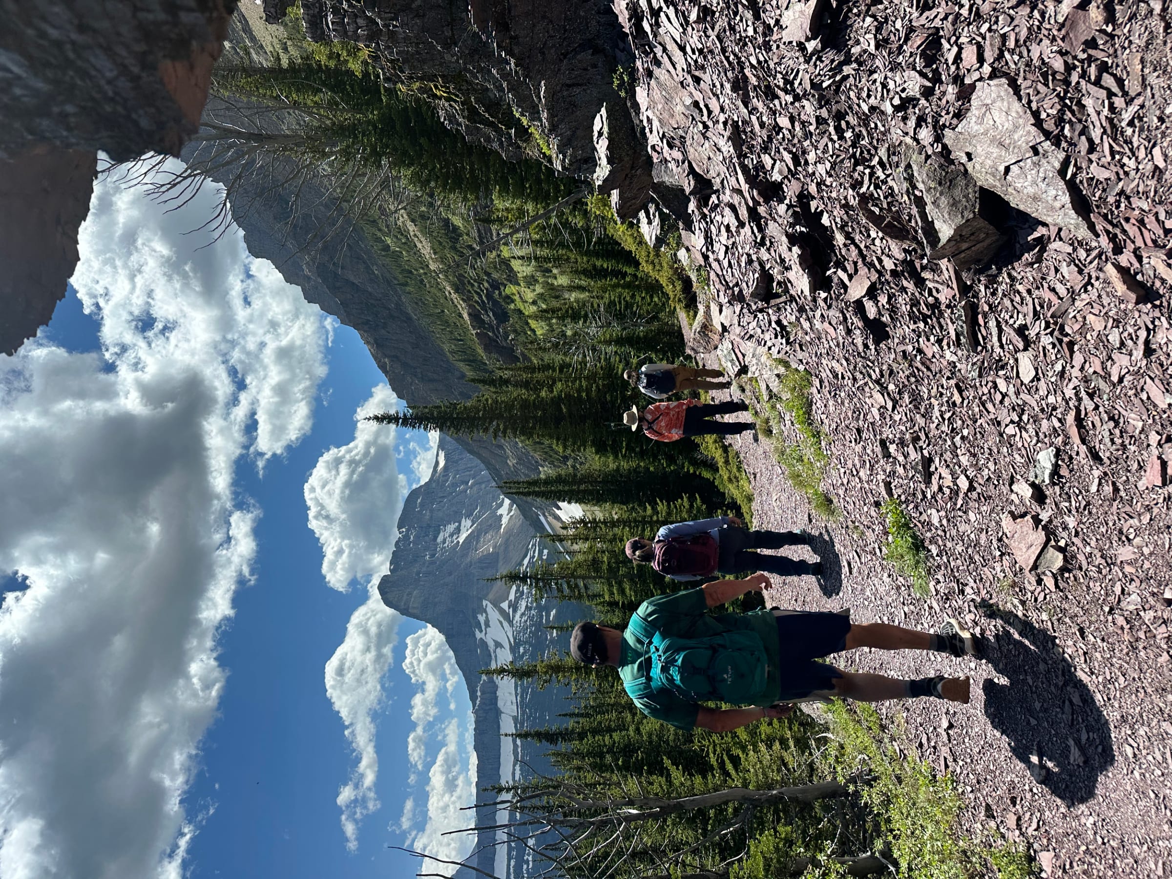 Hikers on a trail in Glacier National Park