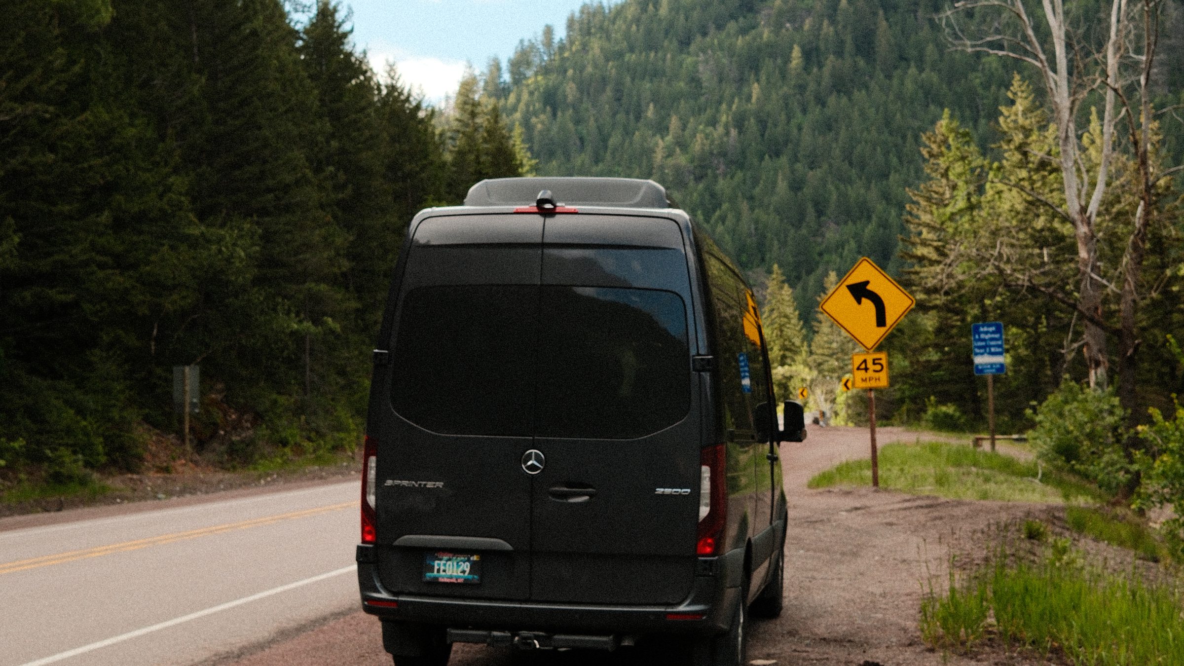 The shuttle van on a mountain road