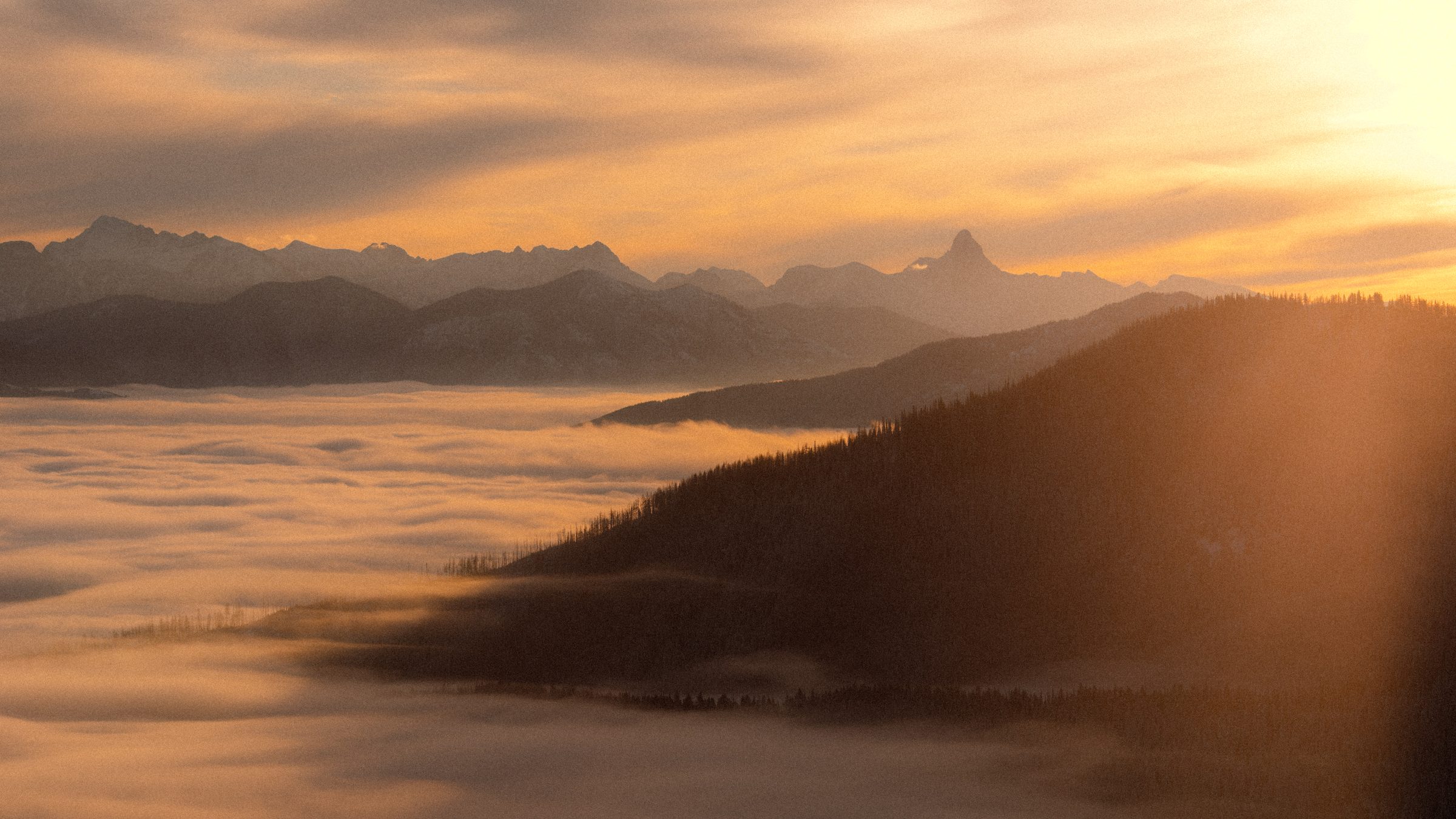 A cloud inversion filling the valley below the mountains