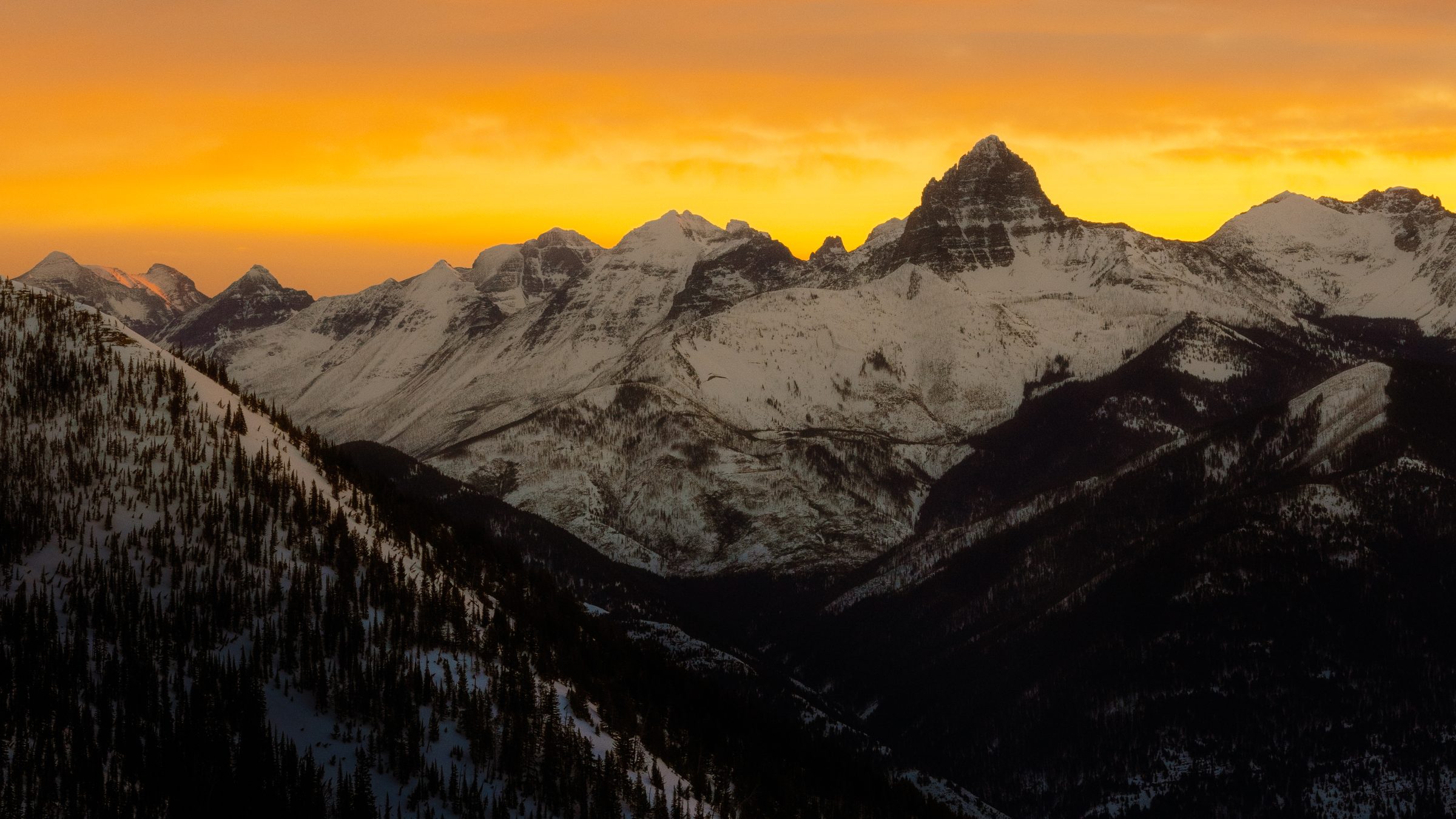 Winter sunrise over the peaks of Glacier National Park